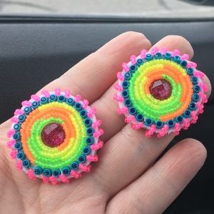 Neon frosted beaded earrings with zebra vinyl backing. Post backs.